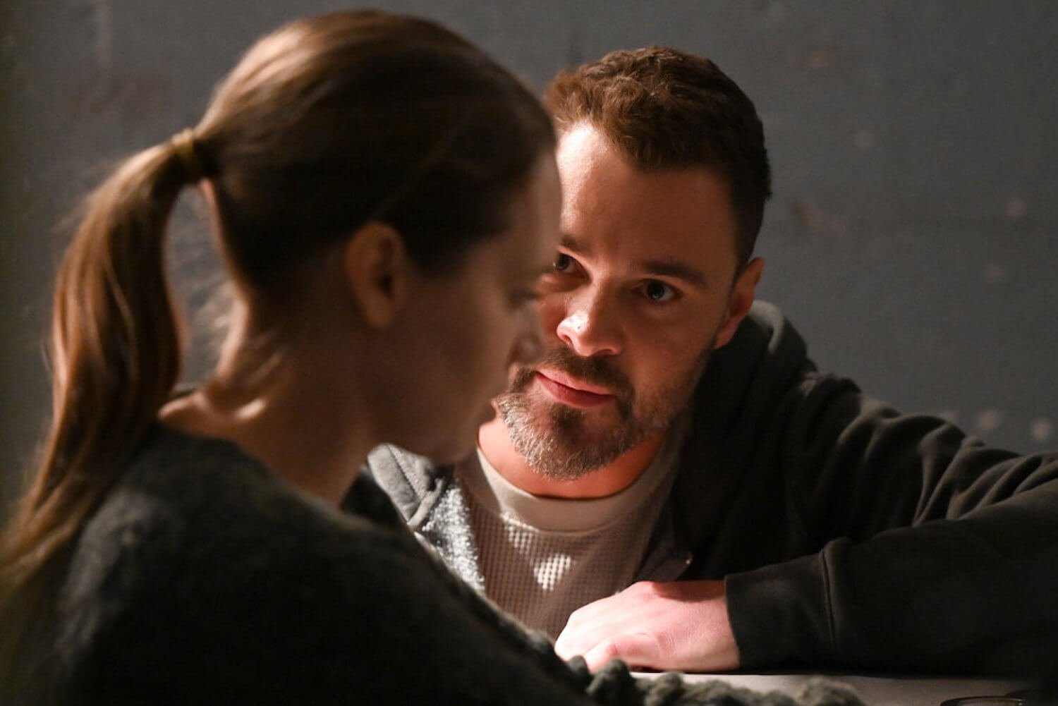 Patrick John Flueger as Adam Ruzek speaking to Kim Burgess closely in the 'Chicago P.D.' Season 10 finale