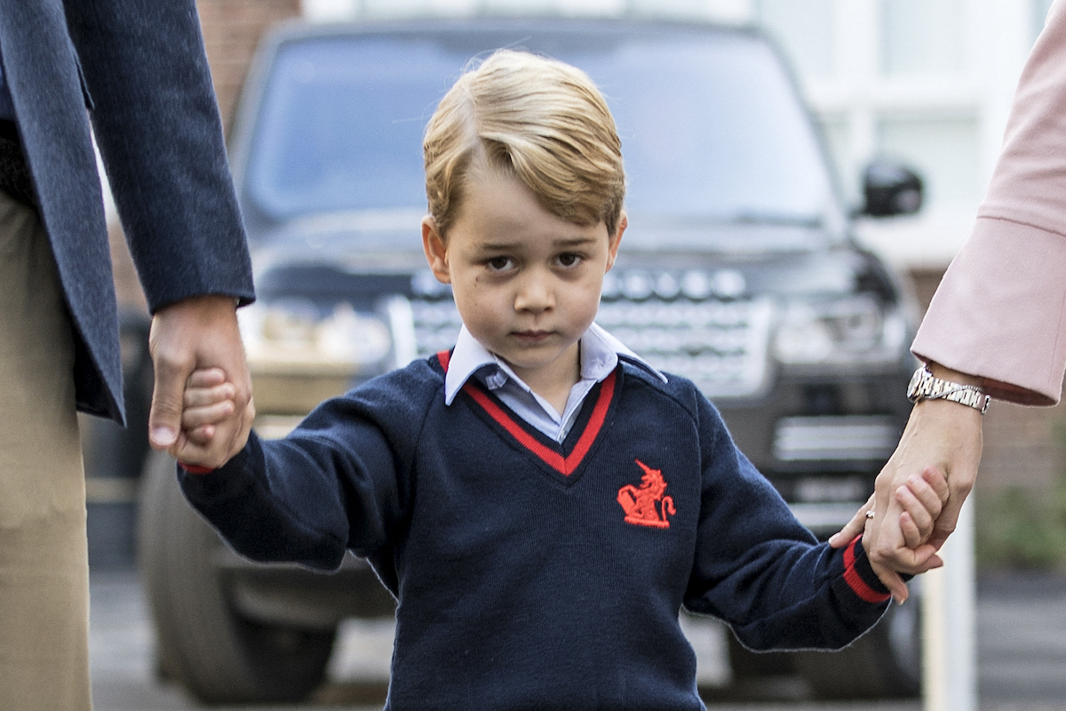 Prince George walks with Prince William, who told him why cameras were there for first day of school, arrives at school
