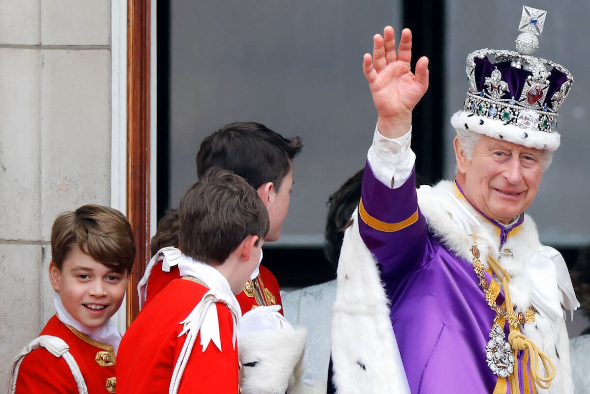 Prince George, whose mother Kate Middleton reportedly is fine with potentially starting a 'rift' with King Charles over her children, stands with King Charles as he waves