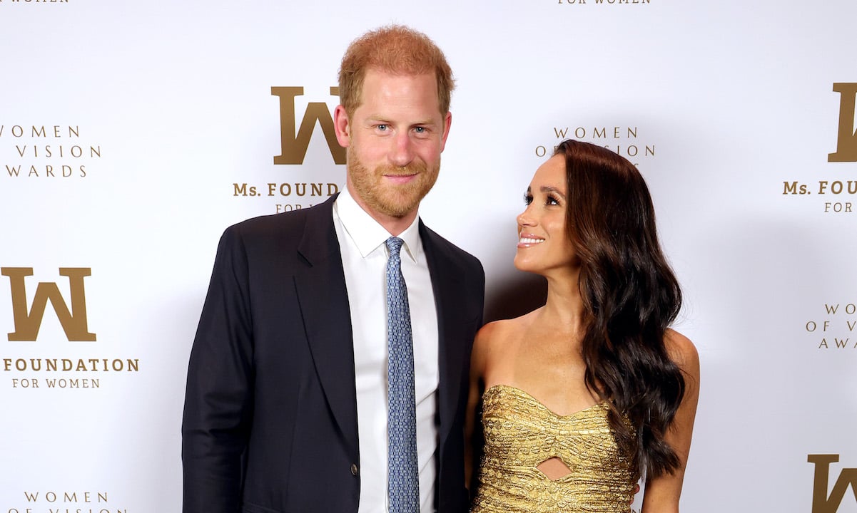 Prince Harry and Meghan Markle; Meghan looks lovingly at Prince Harry