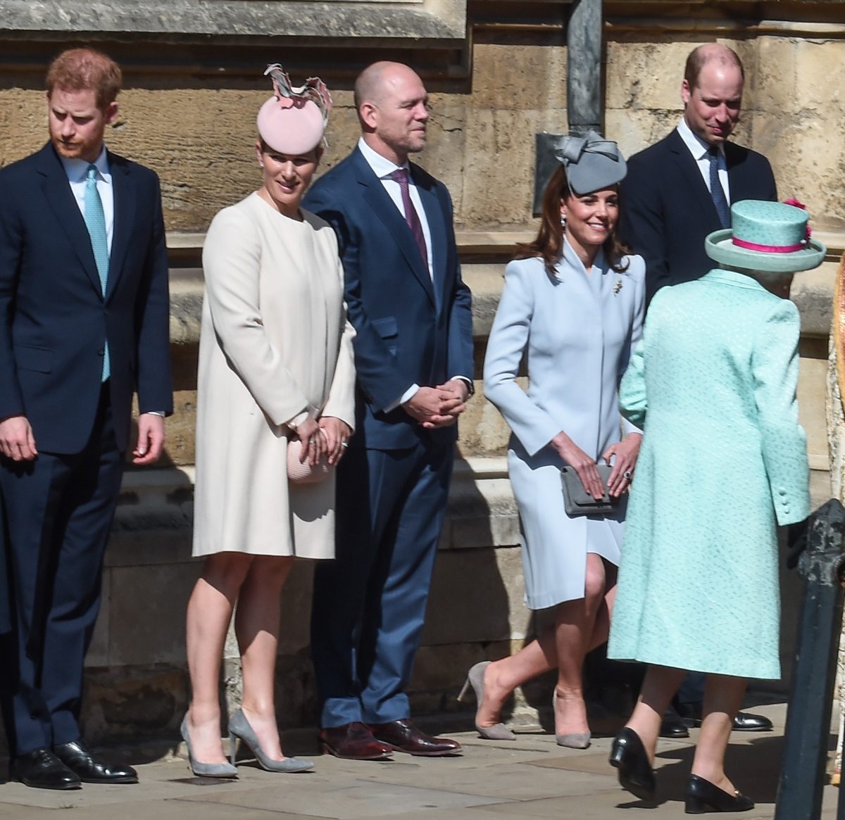 Prince Harry, Prince William, and other members of the royal family greet Queen Elizabeth II as she arrives for the Easter Sunday service at St George's Chapel