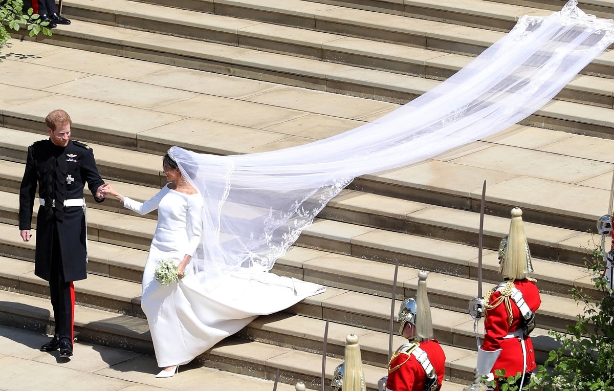Prince Harry and Meghan Markle walk down the west steps of St. George's Chapel, Windsor Castle on their wedding day