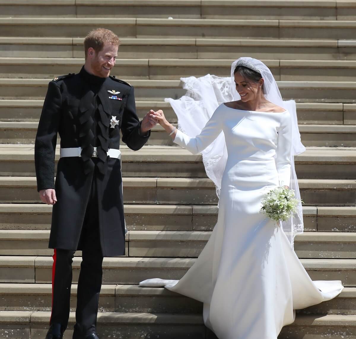 Prince Harry and Meghan Markle, whose dress criticized for being baggy, leaving St George's Chapel after their wedding ceremony