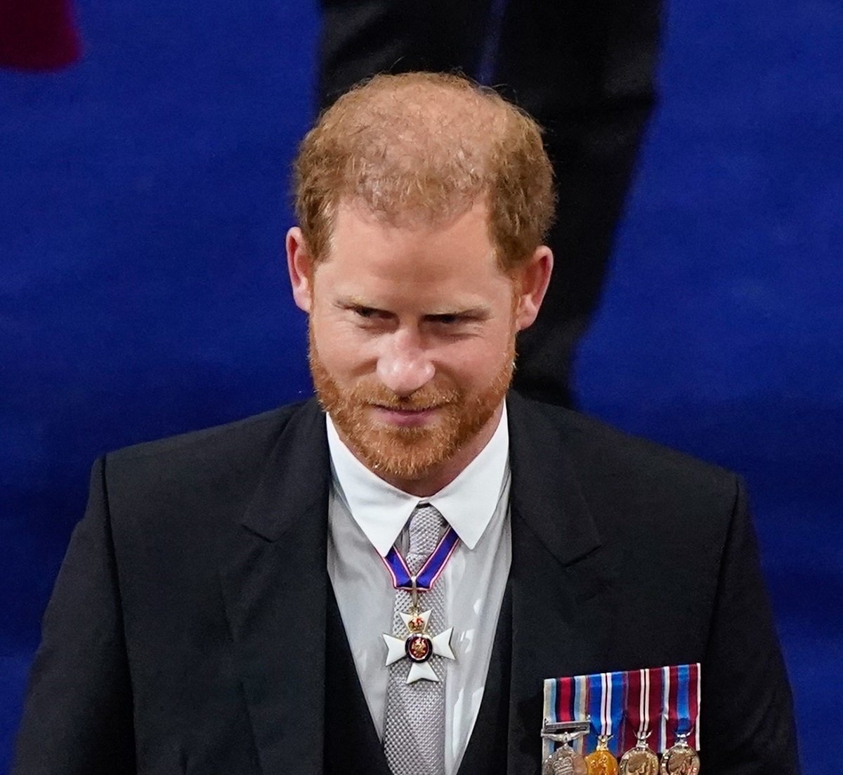 Prince Harry, who a body language observed acting "cocky,", arrives for King Charles III's coronation ceremony at Westminster Abbey