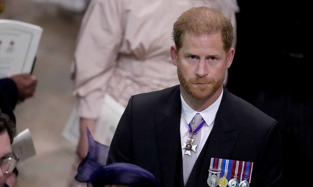 Prince Harry, who a former royal butler thinks felt "awkward" about attending the coronation of King Charles III alone, arriving at Westminster Abbey