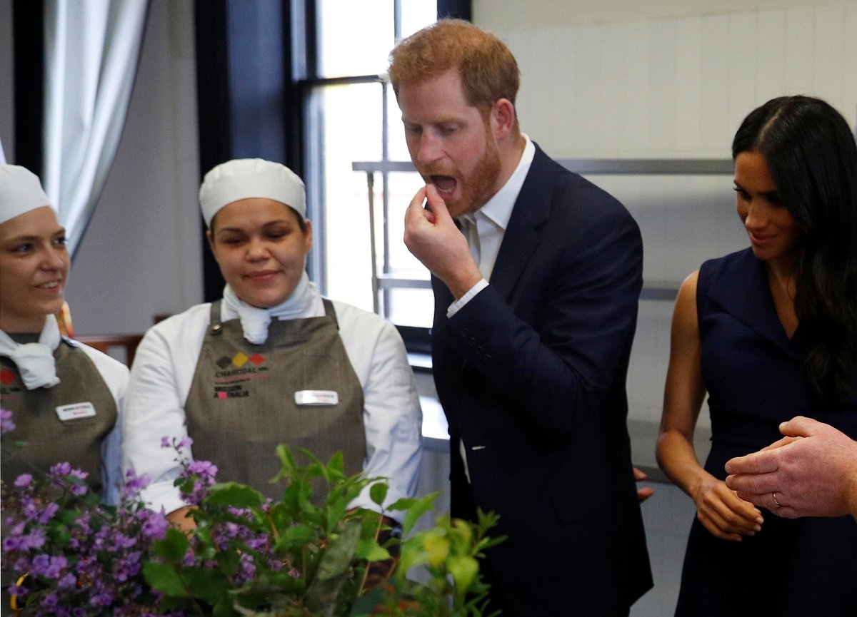 Prince Harry, who did not eat chicken the royal way at a restaurant, trying traditional native Australian ingredients during a visit to Mission Australia