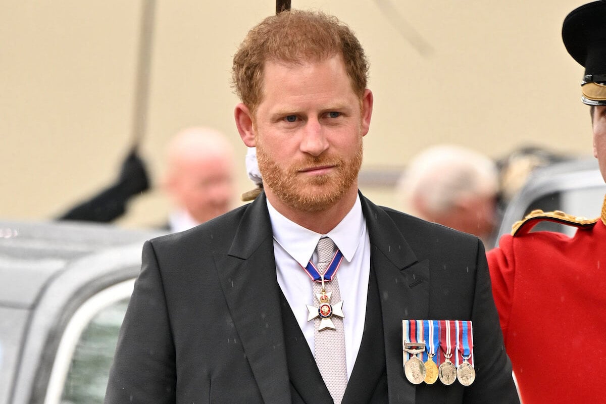 Prince Harry, whose short coronation visit reportedly 'saddened' King Charles, outside Westminster Abbey