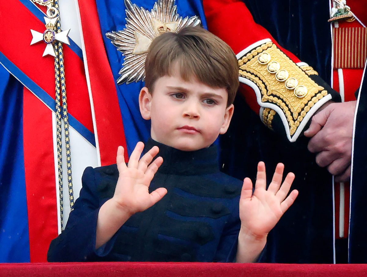 Prince Louis waving from the balcony of Buckingham Palace following King Charles' coronation