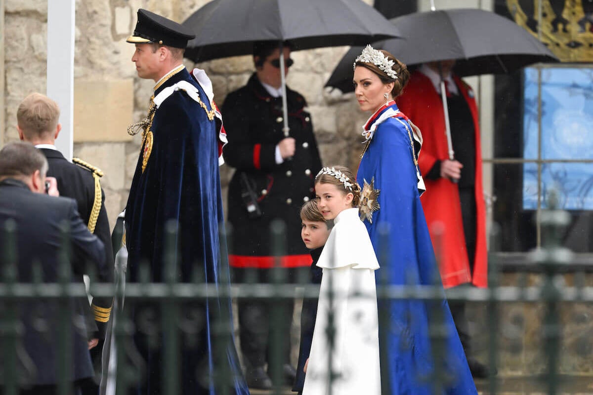 Prince Louis, whom a body language expert called Kate Middleton's 'biggest worry' at the coronation, enters Westminster Abbey with Prince William, Kate Middleton, and Princess Charlotte