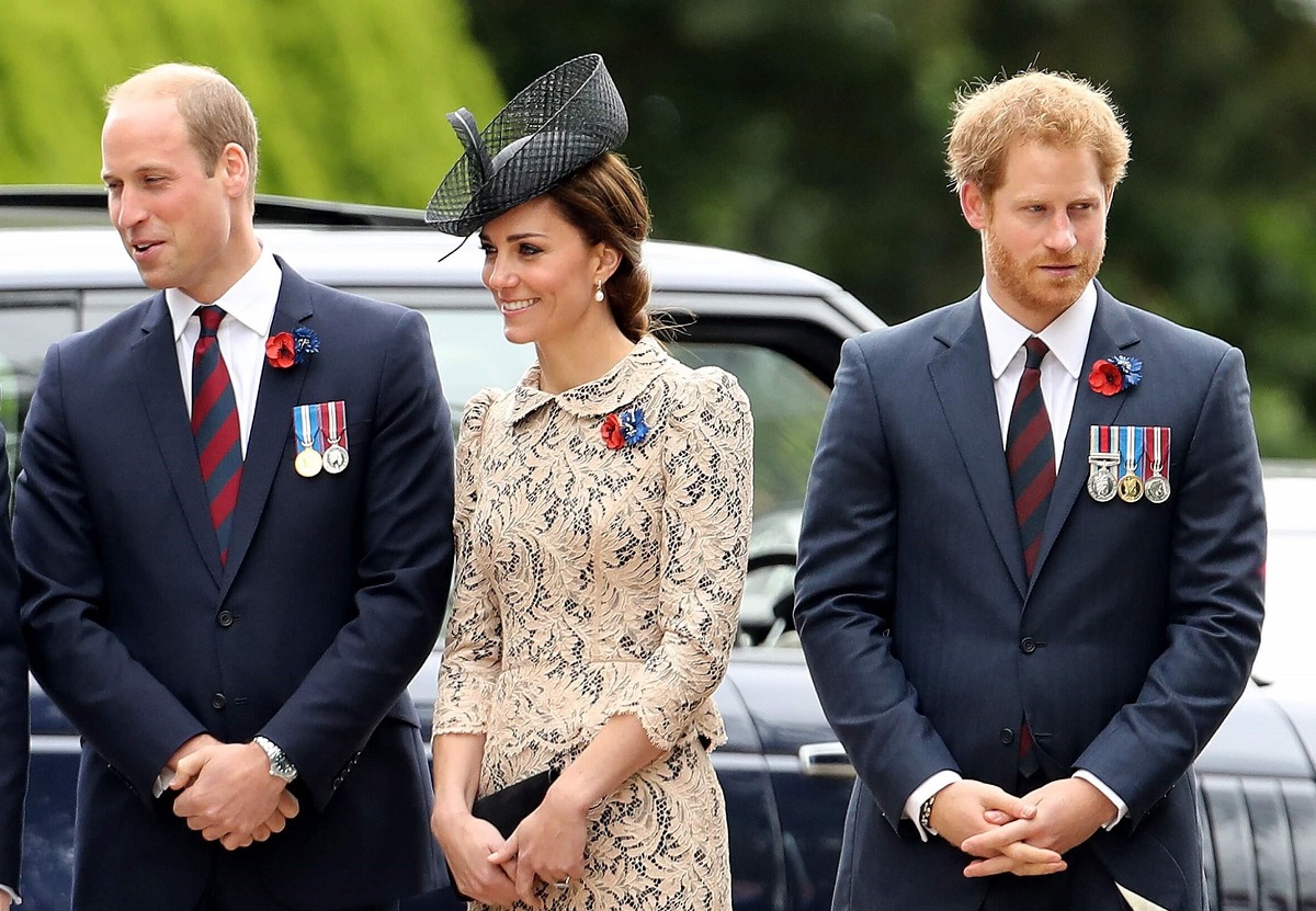 Prince William, Kate Middleton, and Prince Harry, who a body language expert says showed an animal gesture and silent plea in video, attend a service together in France