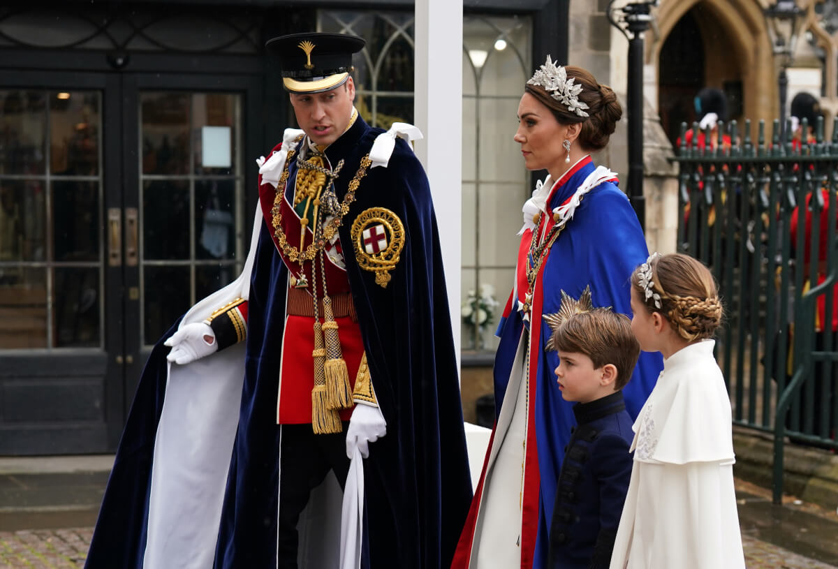 Kate Middleton, Princess of Wales and Prince William, Prince of Wales with Princess Charlotte and Prince Louis arrive at the Coronation of King Charles III and Queen Camilla on May 6, 2023 in London, England