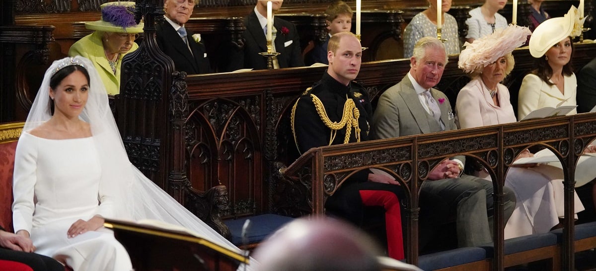 Prince William and Kate Middleton, whose body language during Prince Harry and Meghan Markle's wedding was interesting, sitting with other members of the royal family