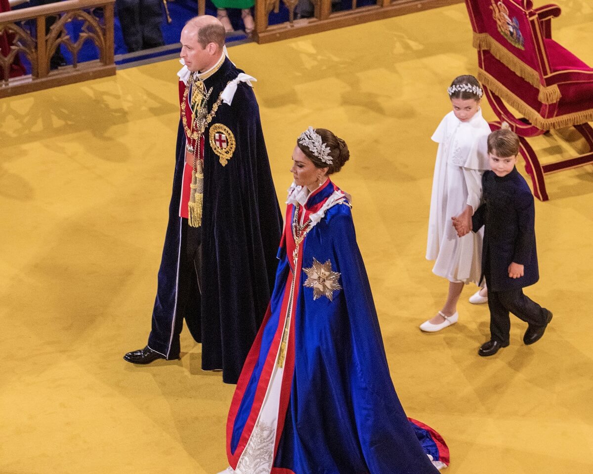 Prince William and Kate Middleton, who arrived late to King Charles' coronation, with Princess Charlotte and Prince Louis walking up the aisle of Westminster Abbey