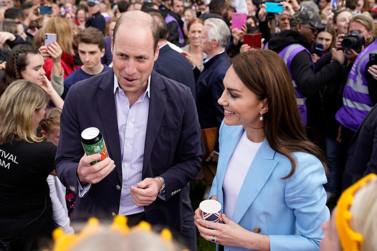 Prince William and Kate Middleton, who may have to change their 'view' on charity work with more royal patronages, greet crowds ahead of the coronation and look on