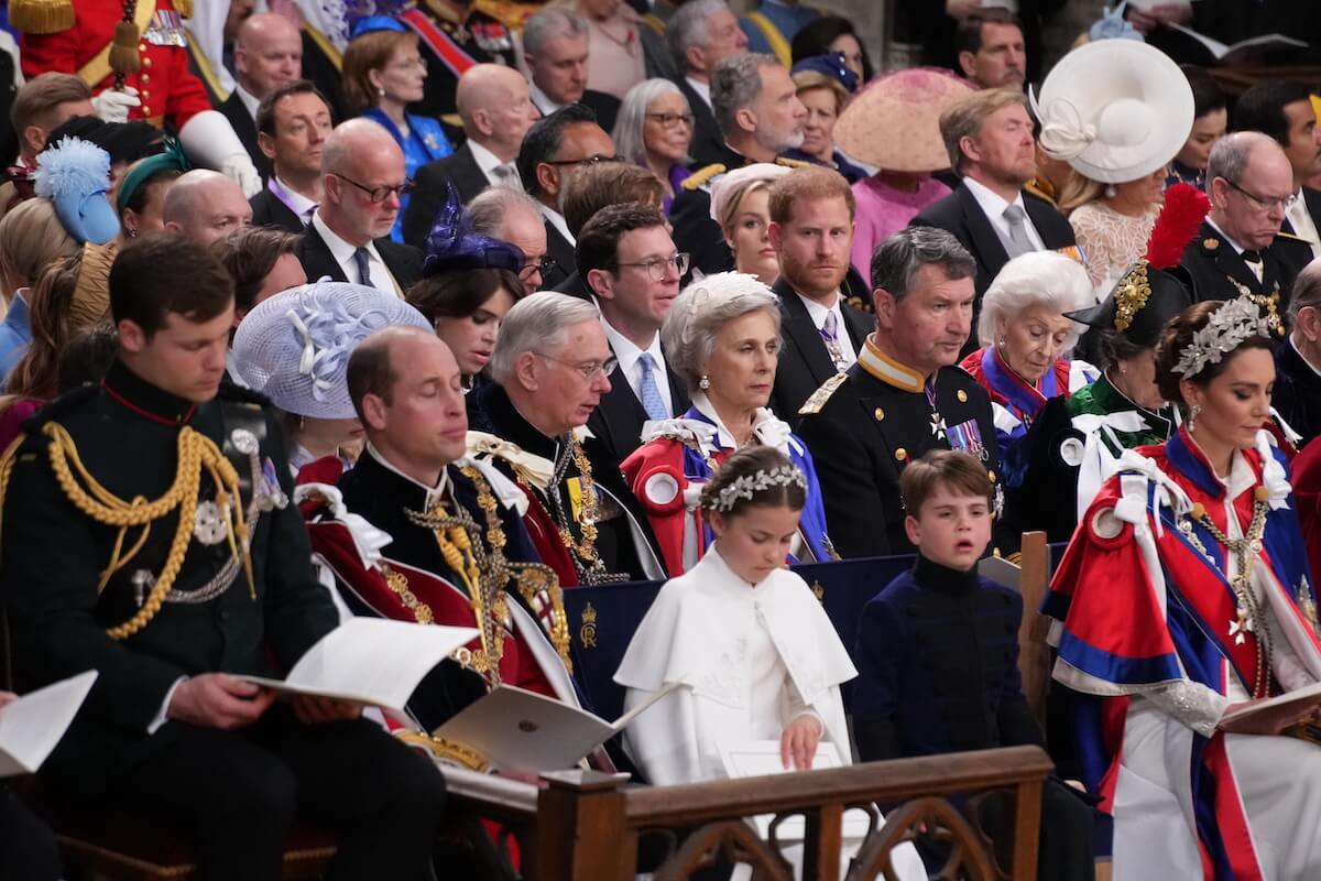 Prince Harry, who had 'severe side-eye' for Prince William at Westminster Abbey during the coronation, looks on as Prince William sits ahead of him