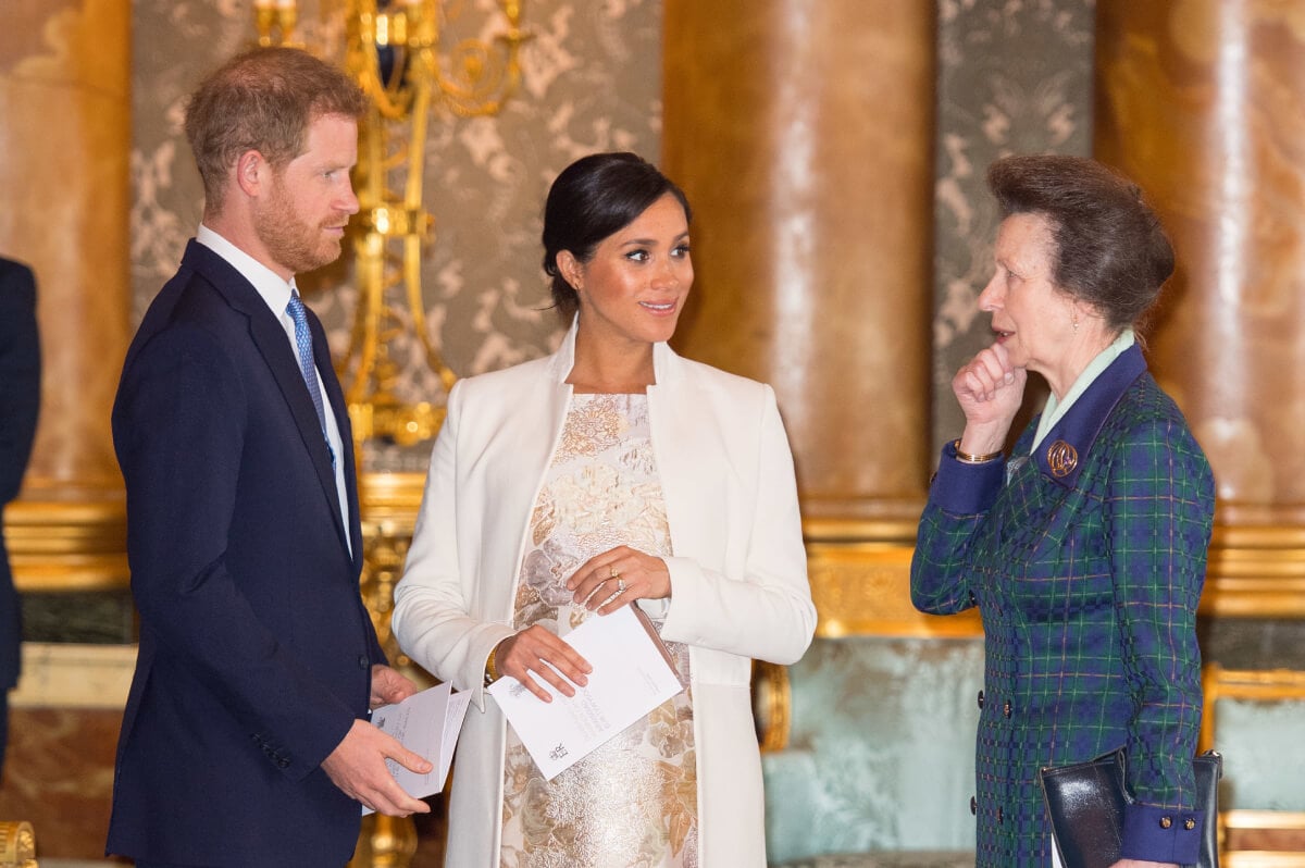 Prince Harry, Duke of Sussex, Meghan Markle, Duchess of Sussex and Princess Anne, Princess Royal attend a reception to mark the fiftieth anniversary of the investiture of the Prince of Wales at Buckingham Palace on March 5, 2019 in London, England