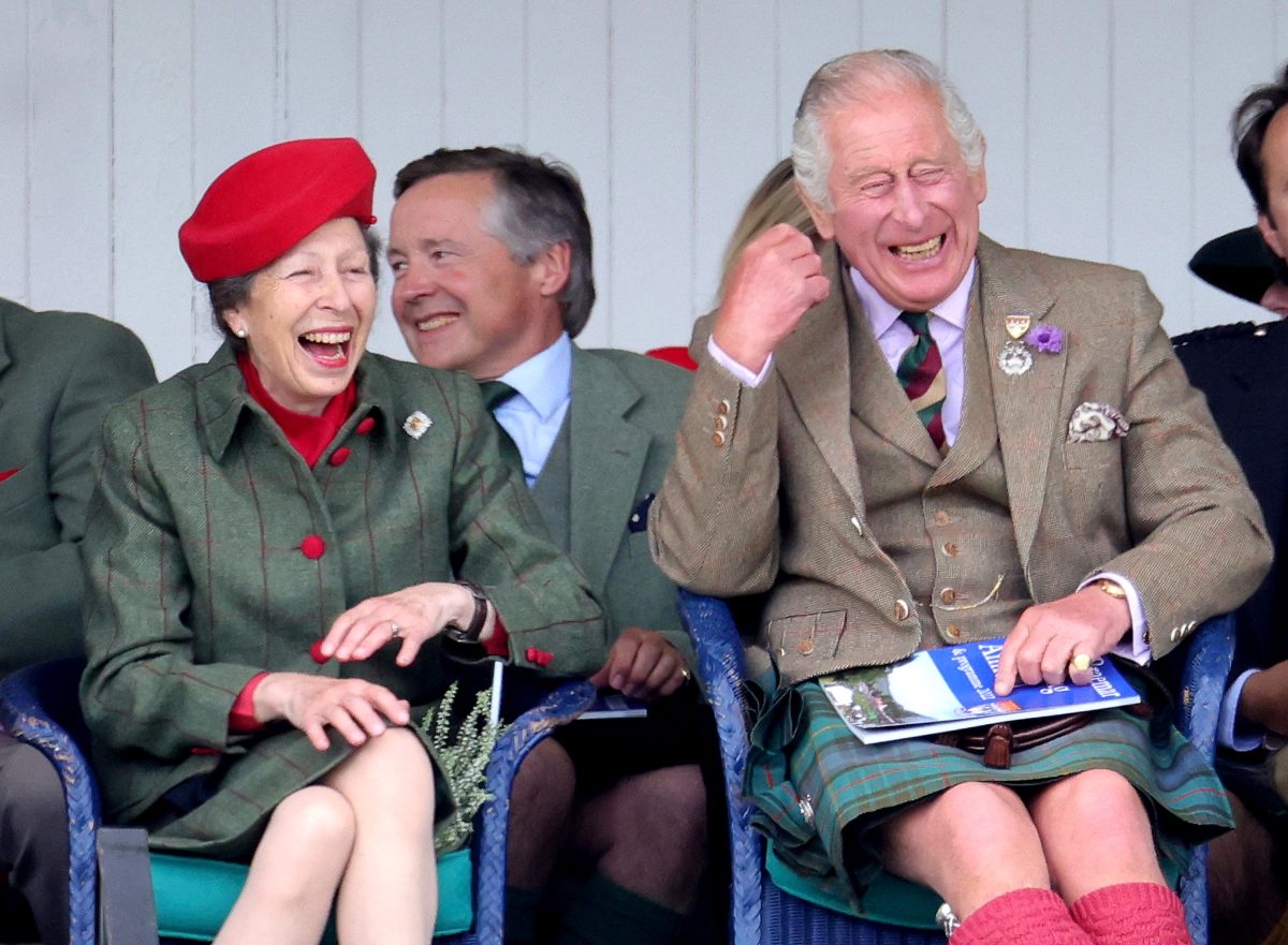 Princess Anne and King Charles III laughing during the Braemar Highland Gathering