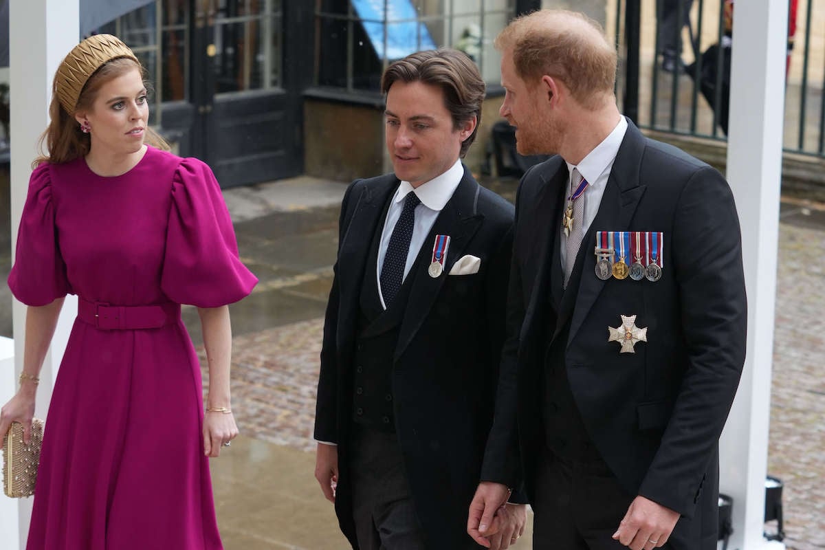 Princess Beatrice looks at Edoardo Mapelli Mozzi and Prince Harry at the coronation, where Kate Middleton wore what a fashion expert called a 'rather plain' coronation gown