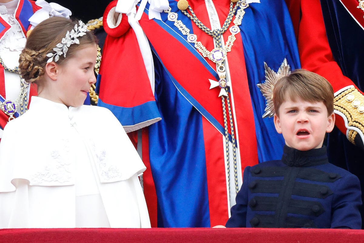 Princess Charlotte and Prince Louis, who had memorable coronation weekend facial expressions along with Prince George, on the Buckingham Palace balcony