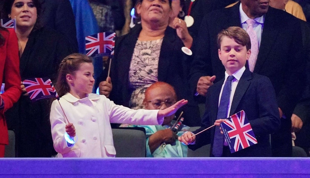 Princess Charlotte, who a lip reader revealed what she said to Prince George at Coronation concert when Prince William was on stage, playing with Union Jack flags