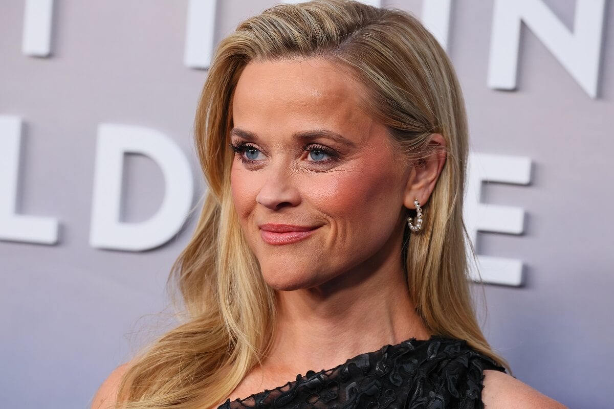 Reese Witherspoon smirking at the 'Last Thing He Told Me' premiere.