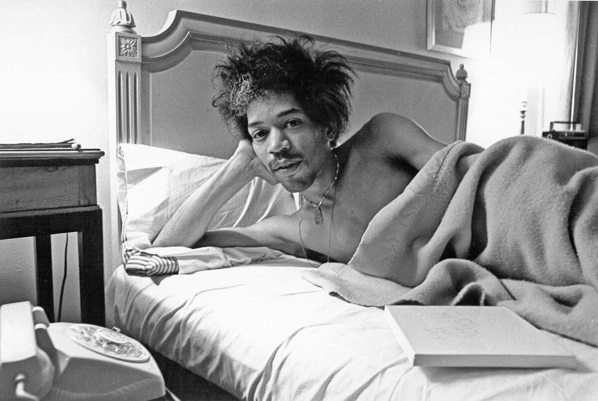 Rock and roll star Jimi Hendrix rests in bed at the Drake Hotel in New York City in 1968