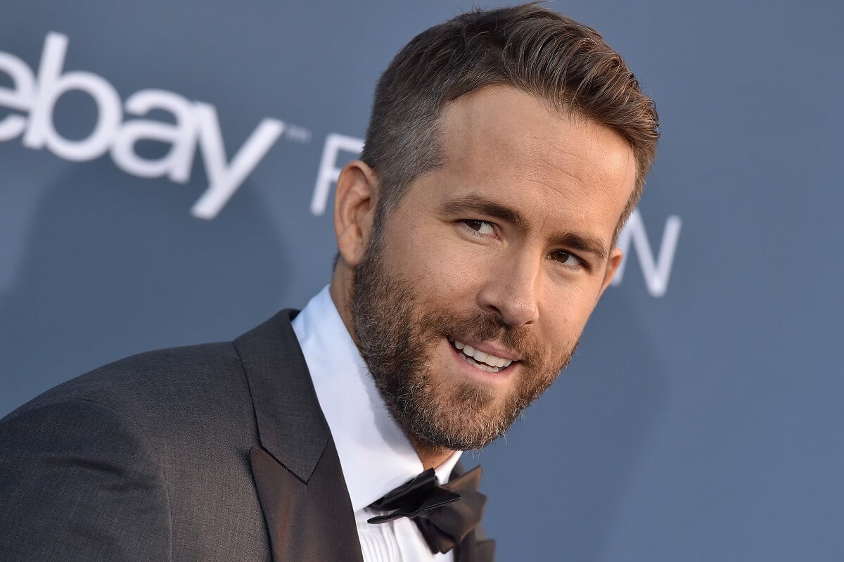 Ryan Reynolds taking a picture while smiling at the 22nd Annual Critics' Choice Awards.