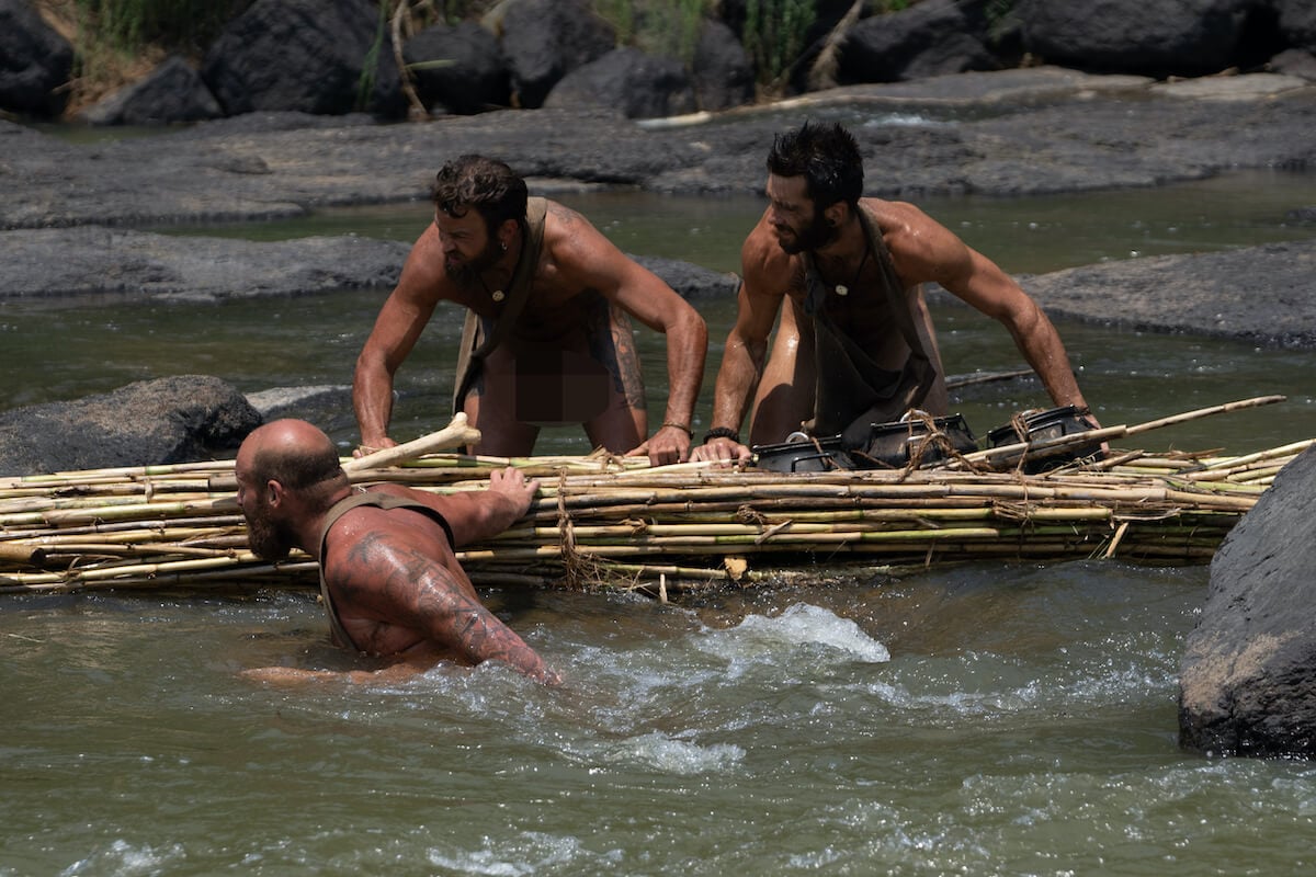 Steven, Waz Addy, and Dan manuever their raft downstream in 'Naked and Afraid: Last One Standing'