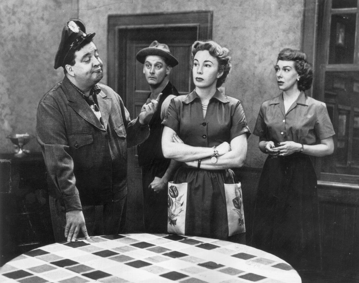 The cast of 'The Honeymooners' in their standard wardrobes on the set in an undated photo