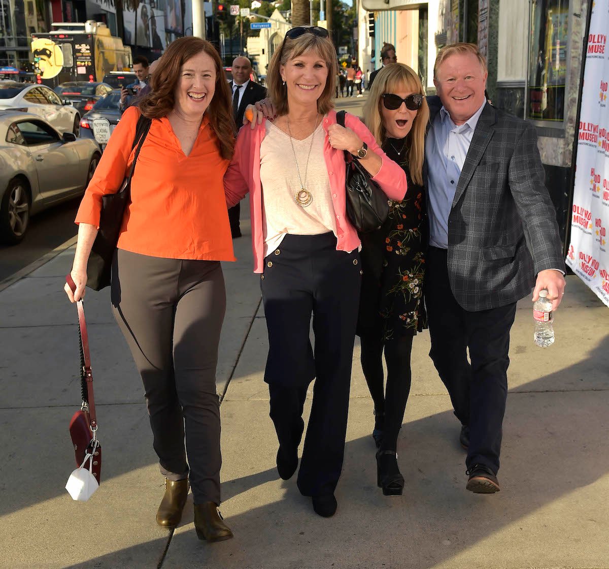 'The Waltons' cast members Kami Cotler, Judy Norton, Mary Beth McDonough and Eric Scott walking down the street in 2022