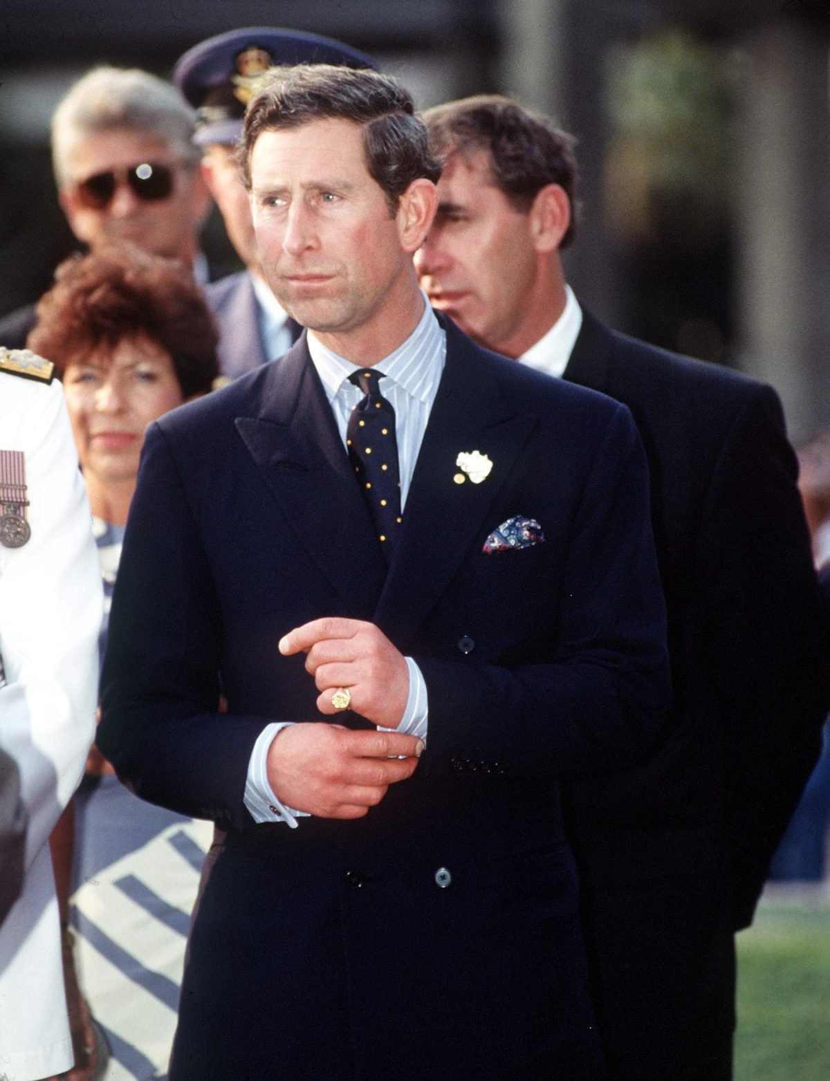 Then-Prince Charles tugging at his cufflinks during trip to Australia