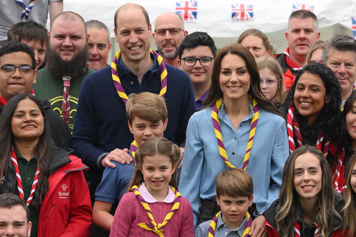 Wales children 'leader' Princess Charlotte, Prince George, Prince William, Kate Middleton, and Prince Louis pose for a group photo alongside volunteers at the Big Help Out during coronation weekend