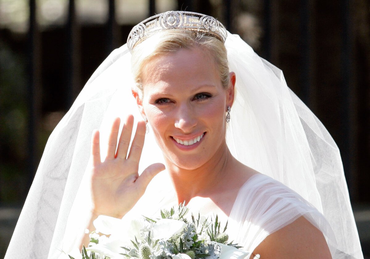 Zara Phillips (Tindall) waves to the crowds as she leaves Canongate Kirk after her wedding to Mike Tindall on July 30, 2011 in Edinburgh, Scotland