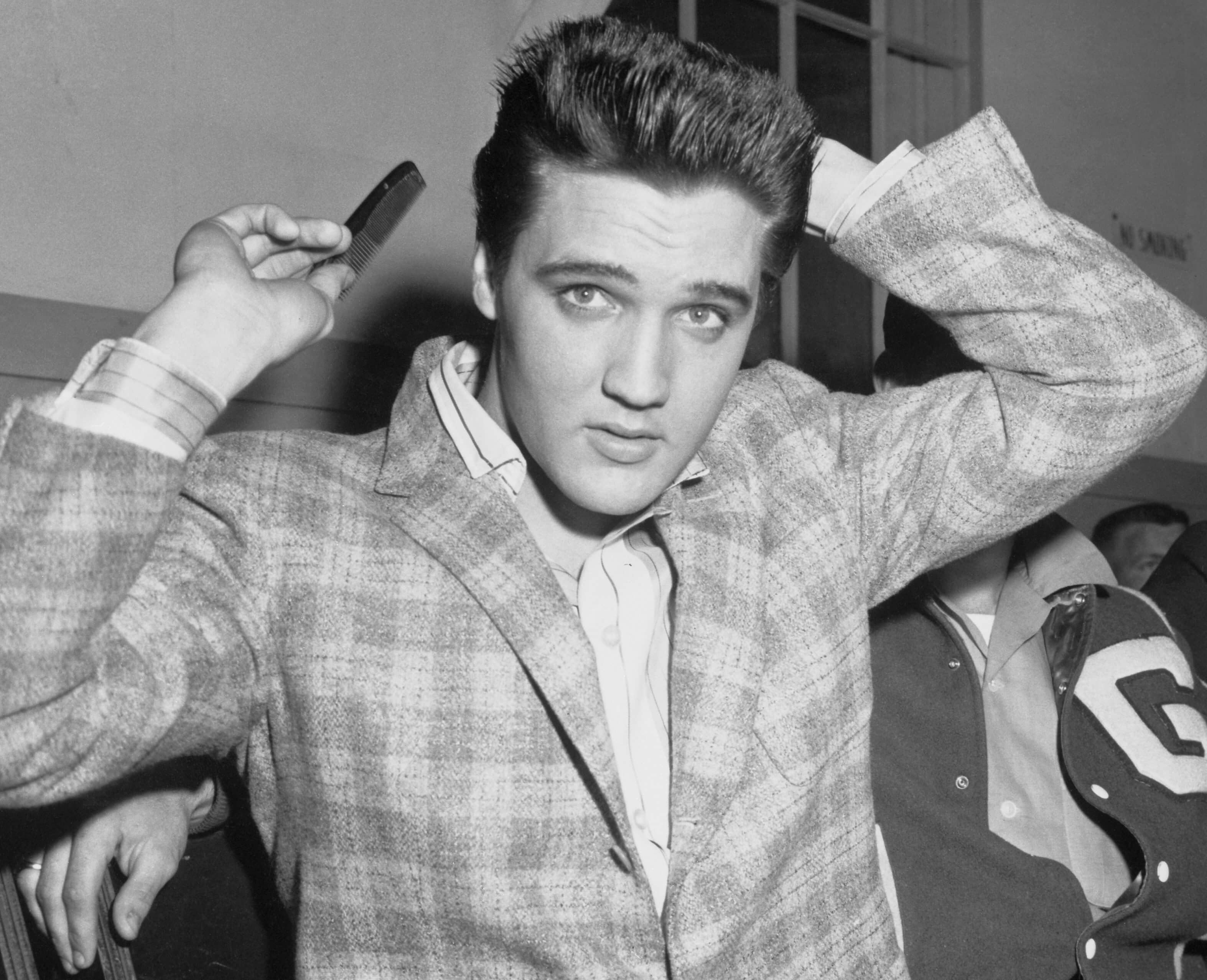Elvis Presley with a comb