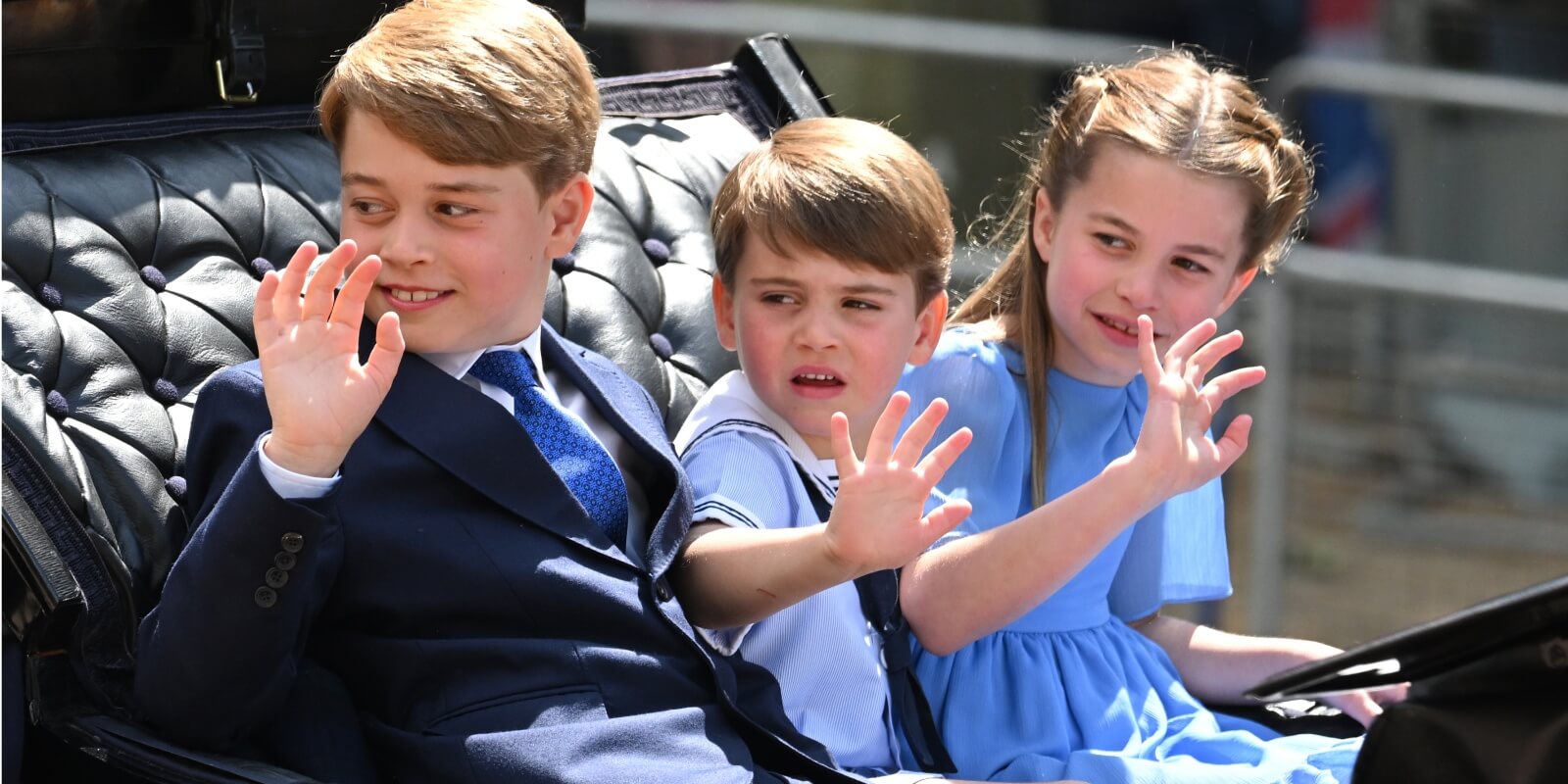 Prince George, Prince Louis, and Princess Charlotte ride in a horse drawn carriage for Trooping the Color in 2022.