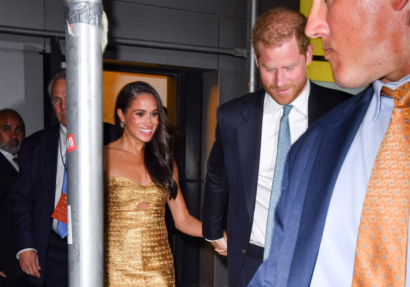Meghan Markle and Prince Harry greet a crowd of fans