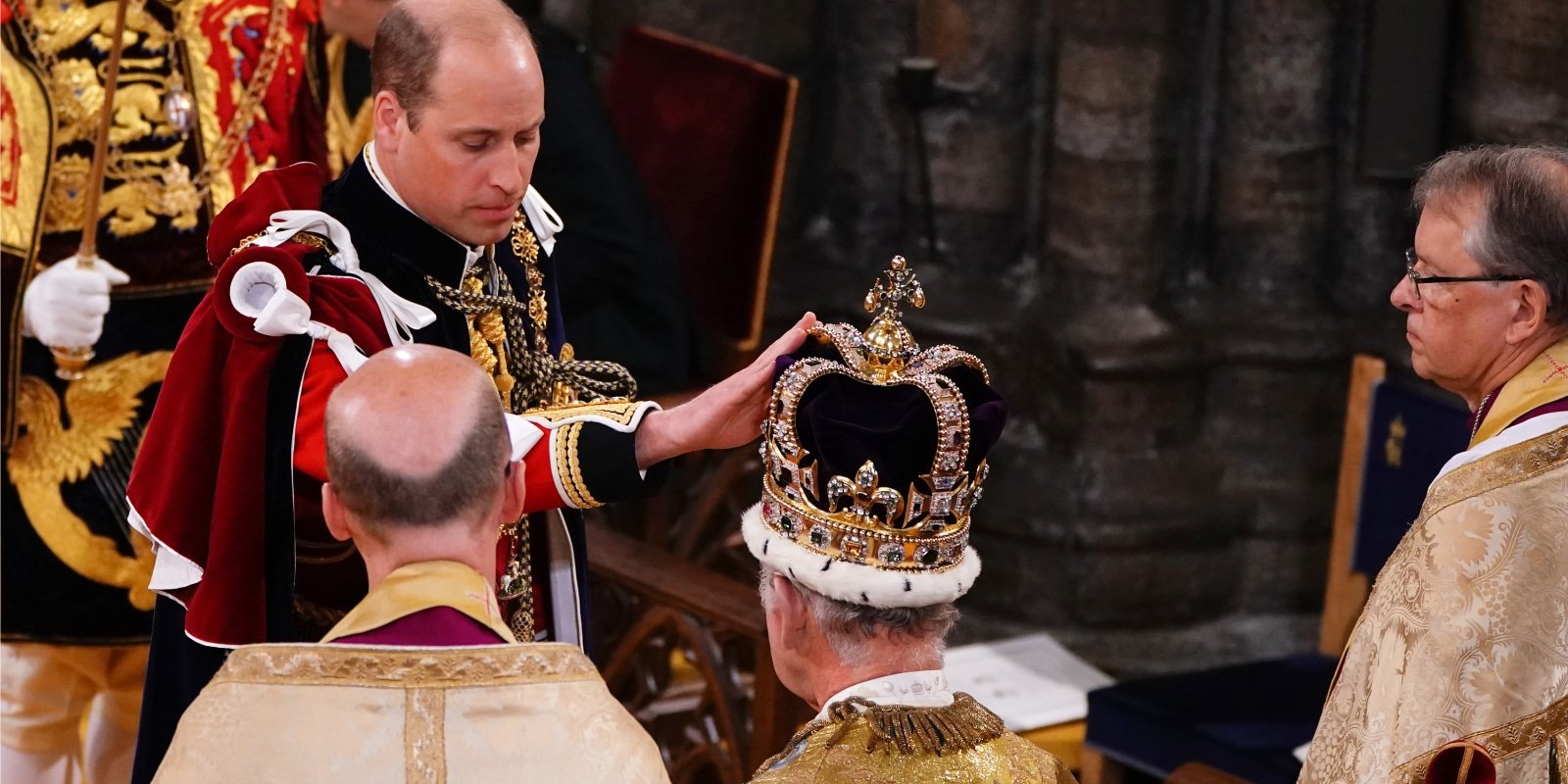 Prince William touches King Charles' crown during his coronation ceremony.