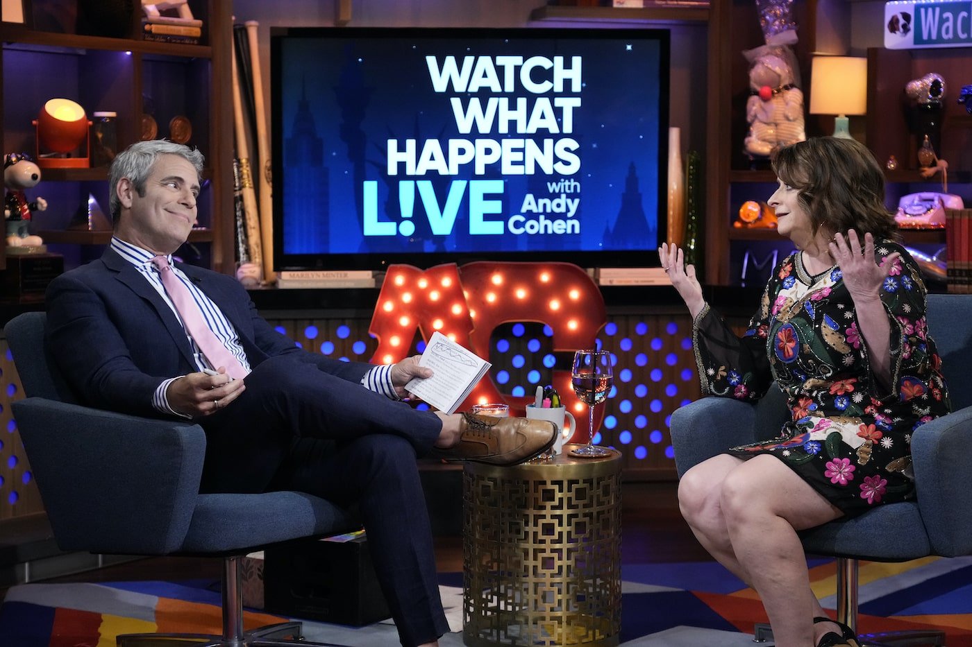 Andy Cohen listens as Rachel Dratch discusses her appearance on 'RHONY.'
