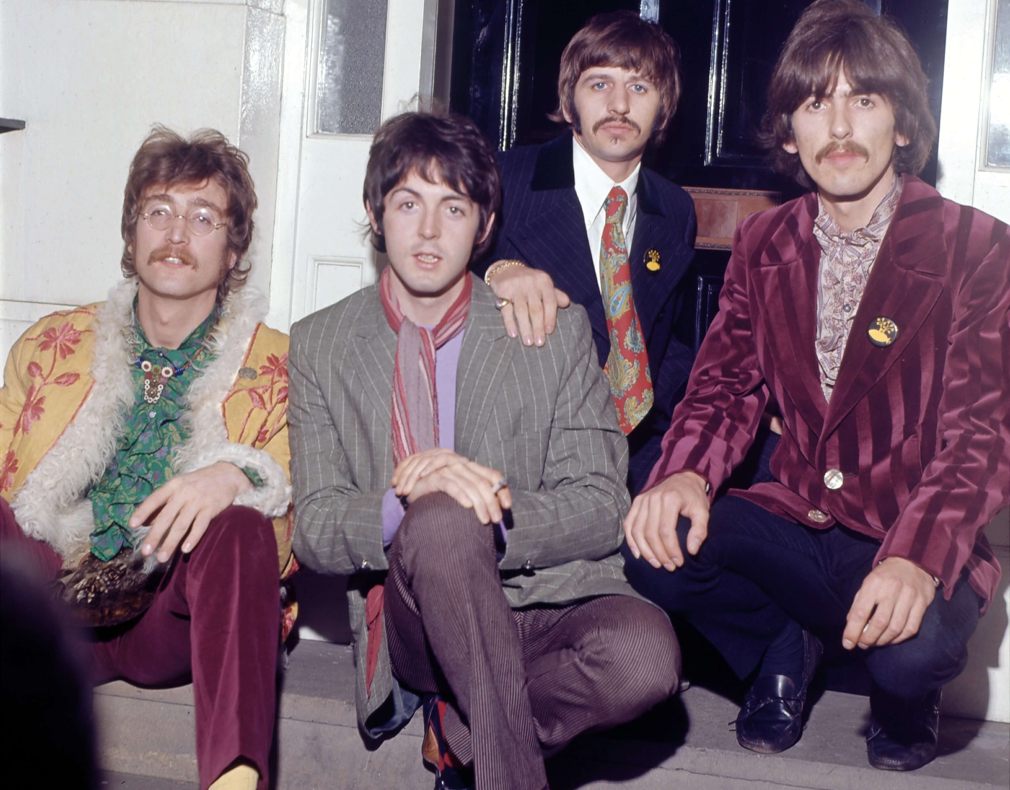 The Beatles sitting during the 'Abbey Road' era