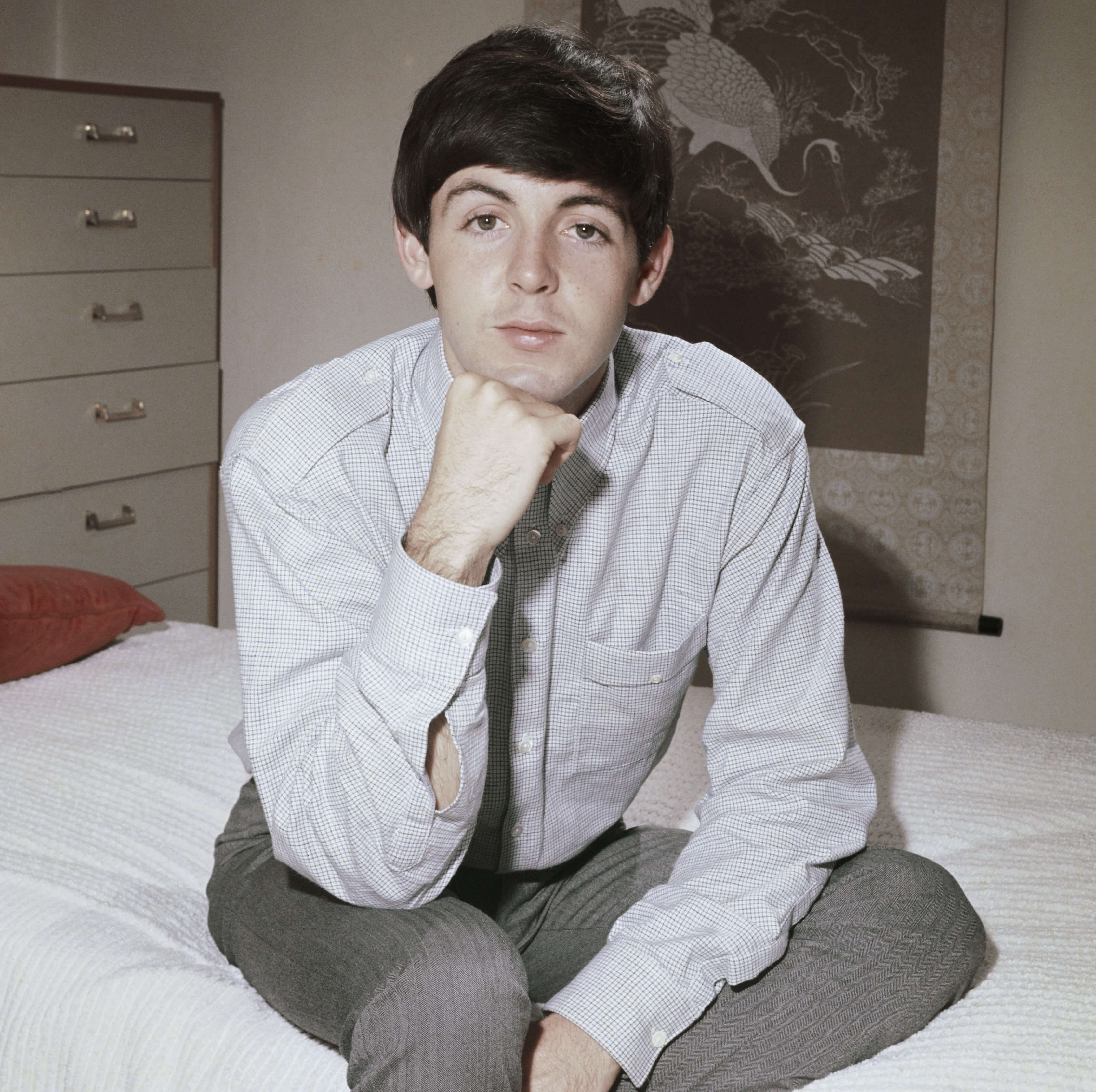 Paul McCartney on his bed during The Beatles' "Can't Buy Me Love" era