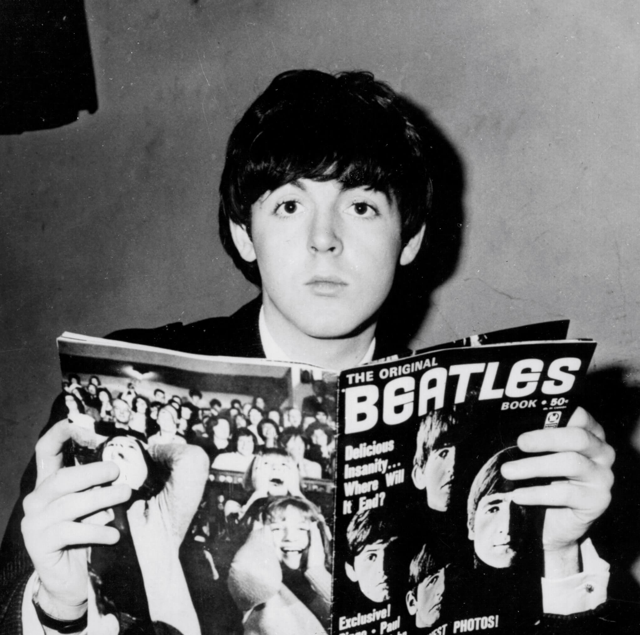 Paul McCartney with a Beatles magazine