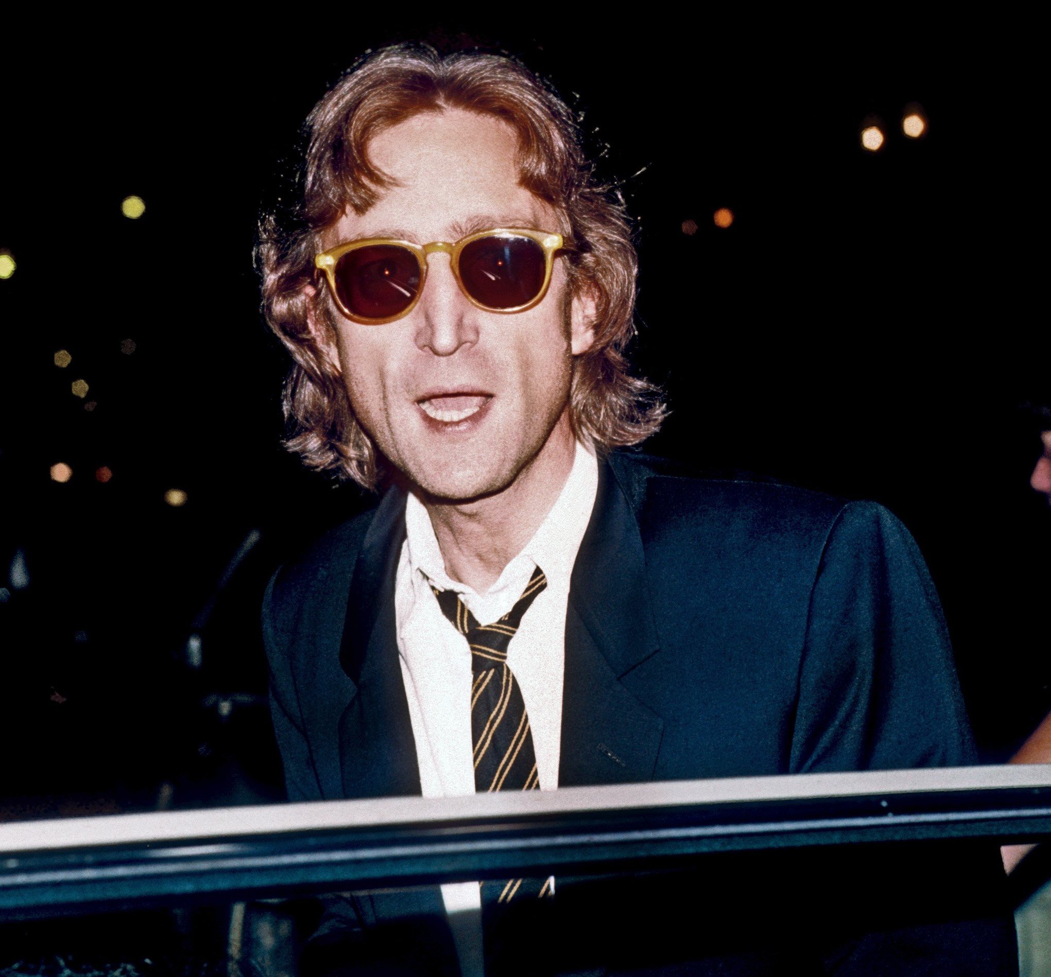 John Lennon near a car door