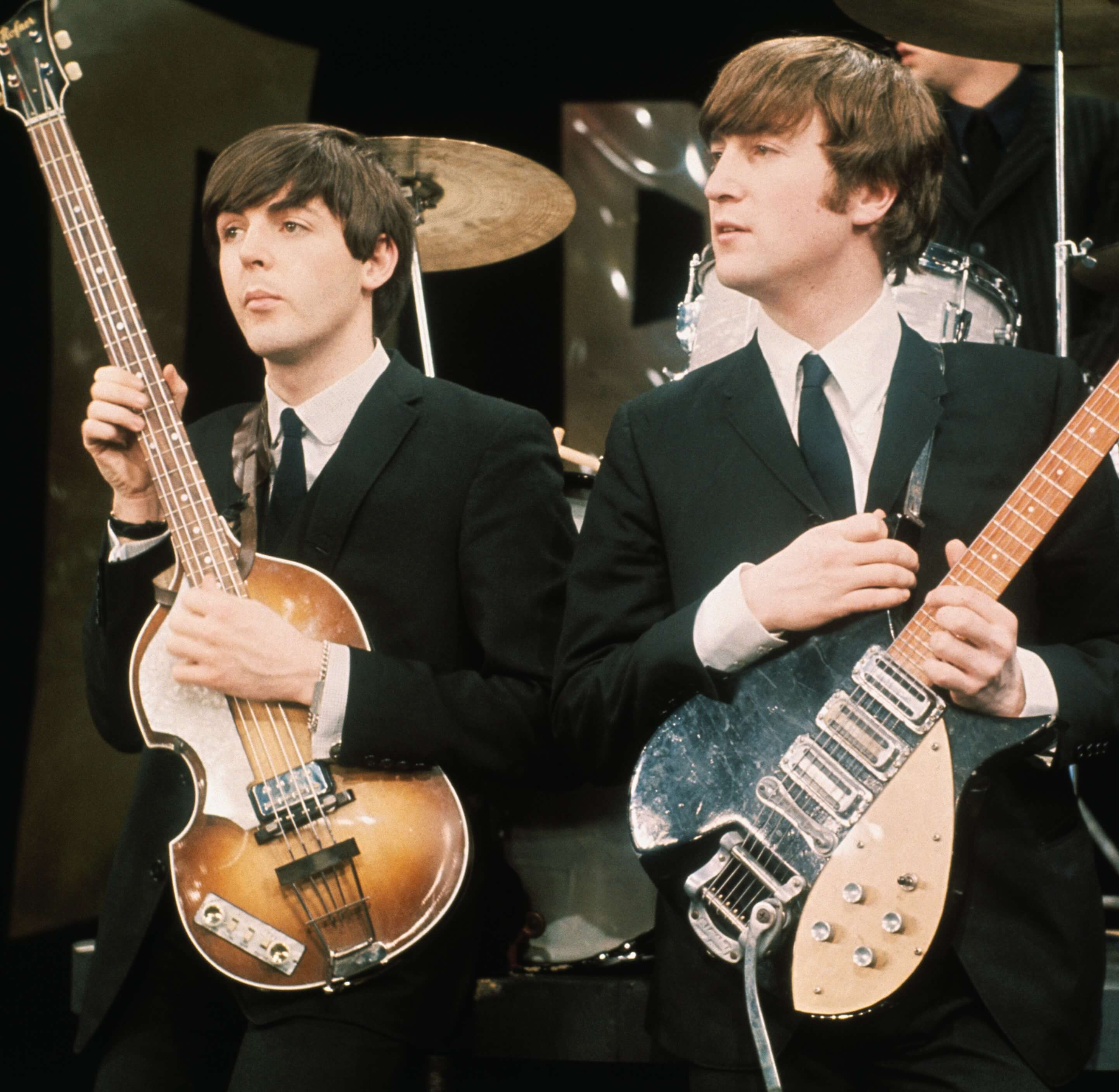 The Beatles' Paul McCartney and John Lennon with guitars