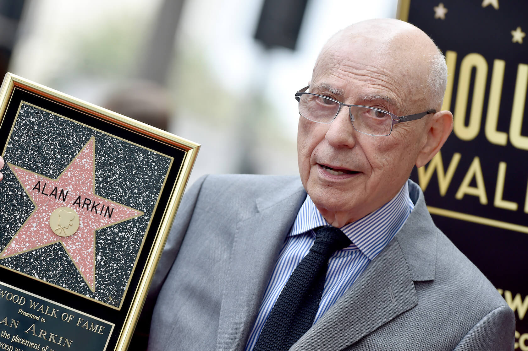 Actor Alan Arkin holding a Hollywood Walk of Fame star