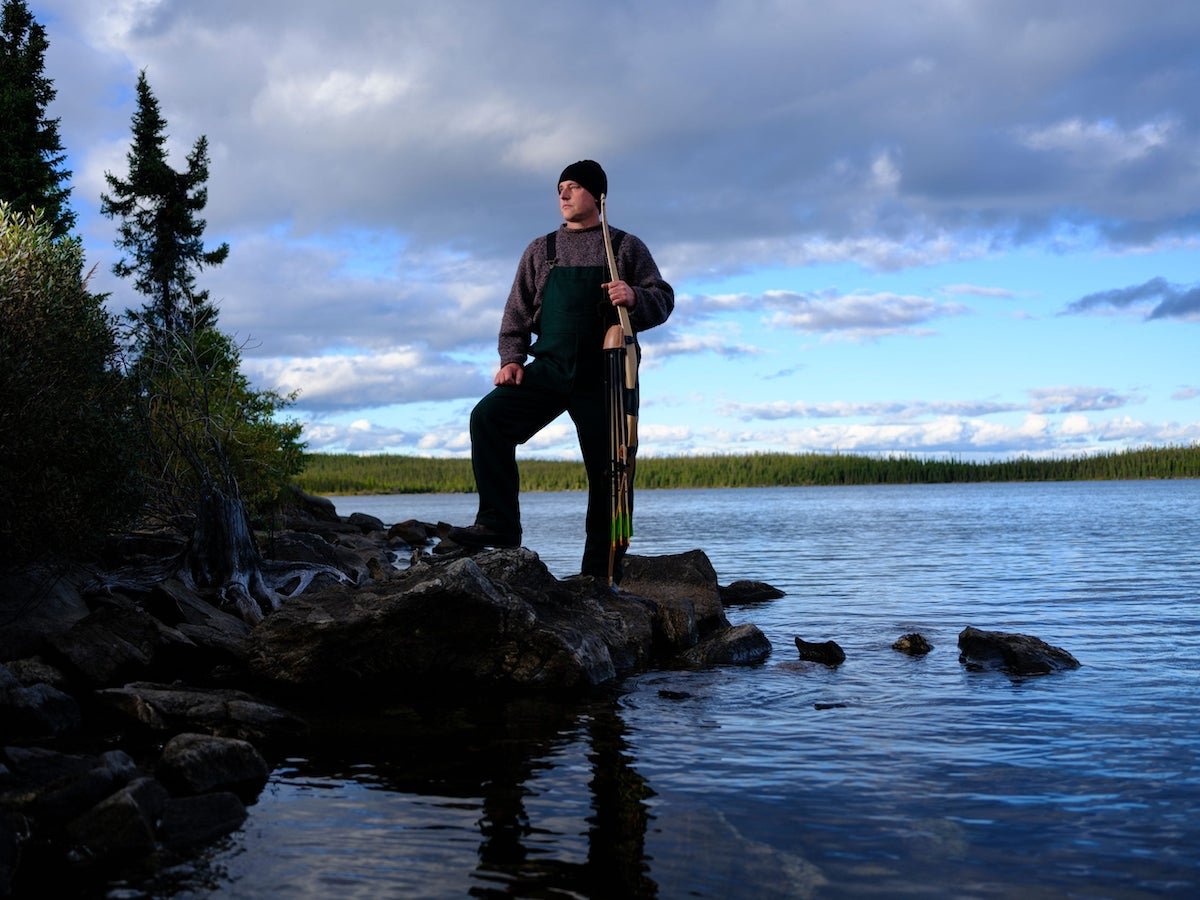 'Alone' Season 10 cast member Alan Tenta posing on a lakeshore
