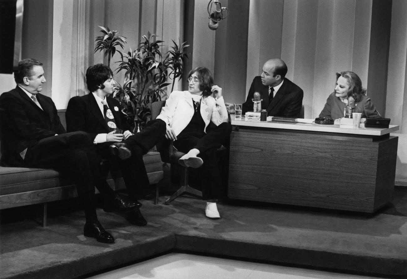 A black and white picture of Ed McMahon, Paul McCartney, John Lennon, Joe Garagiola, and Tallulah Bankhead on the set of 'The Tonight Show.'