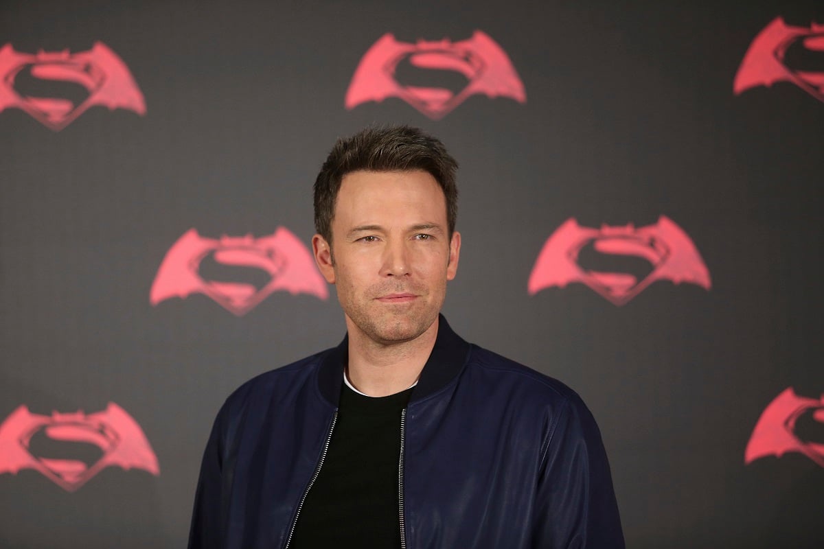 Ben Affleck posing in a black jacket at a photocall for 'Batman v Superman: Dawn of Justice'.