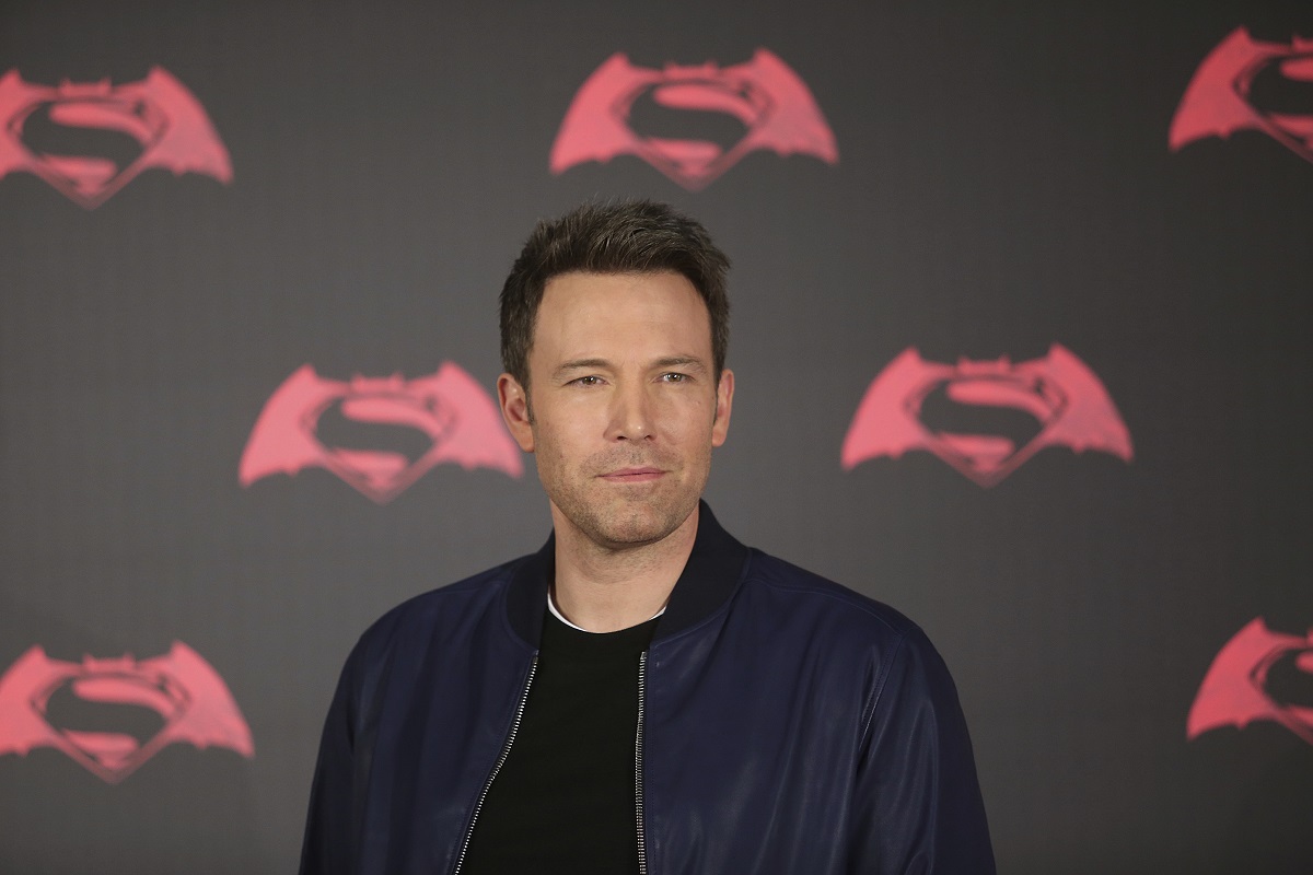 Ben Affleck posing in a black jacket at a photocall for 'Batman v Superman: Dawn of Justice'.