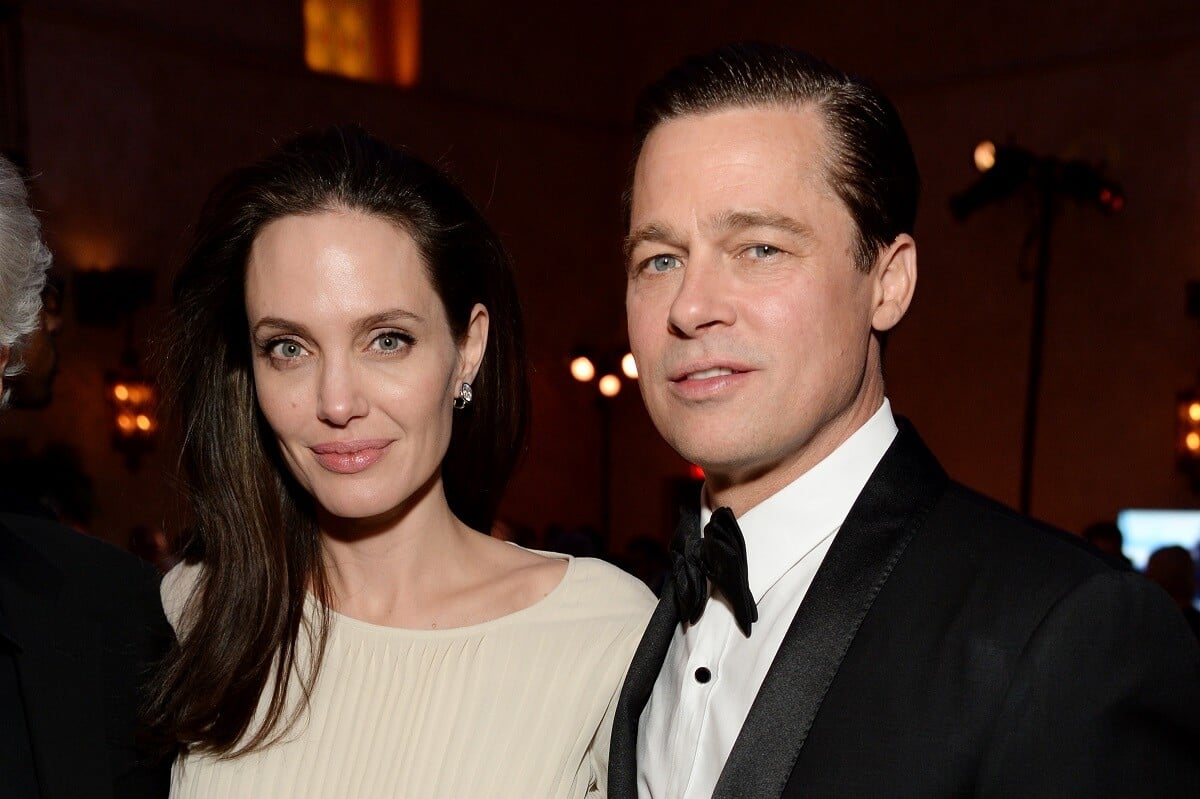 Angelina Jolie and Brad Pitt posing at the premiere of 'By the Sea'