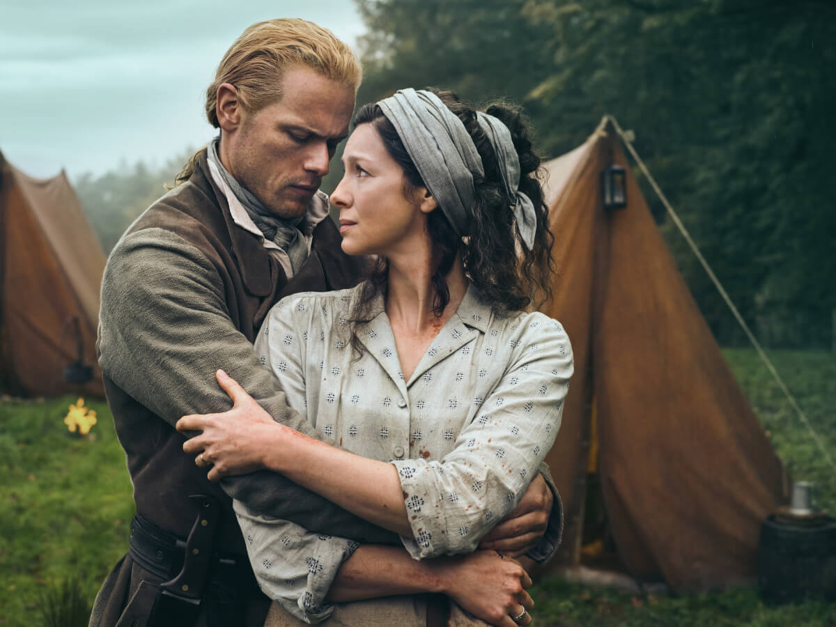 Outlander stars Sam Heughan (Jamie Fraser) and Caitriona Balfe (Claire Fraser) in an image from season 7